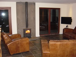 The wood burner, widescreen television and comfortabe seats