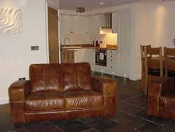 The sitting room, dining room and kitchen at Kingston House, Orkney
